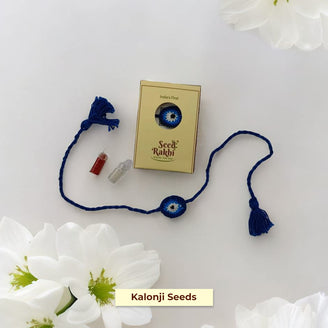 Neel Nazar Battu Eco-Friendly Seed Rakhi Set (1 Seed Rakhi + Roli Chawal + Greeting Card )